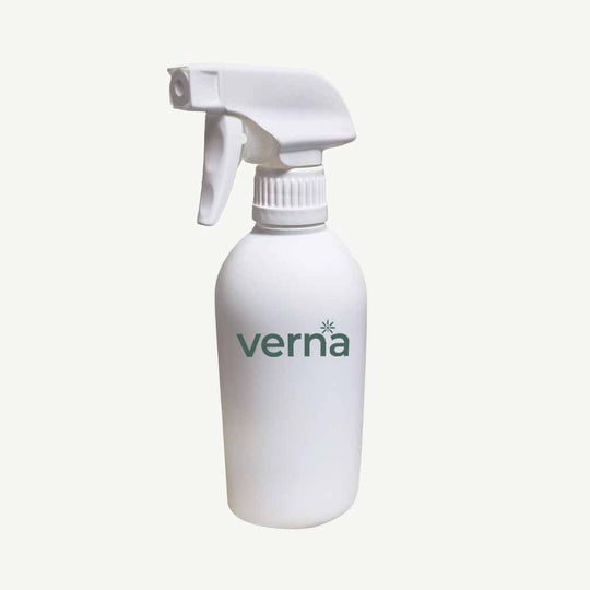 White spray bottle with 'verna' branding on a white background