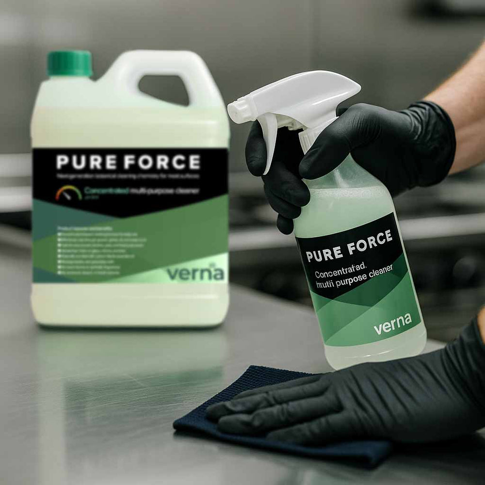Pure Force cleaning product with a person wearing gloves and a cloth on a metallic surface.